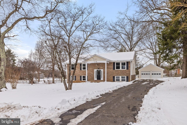 bi-level home with an outbuilding and a garage