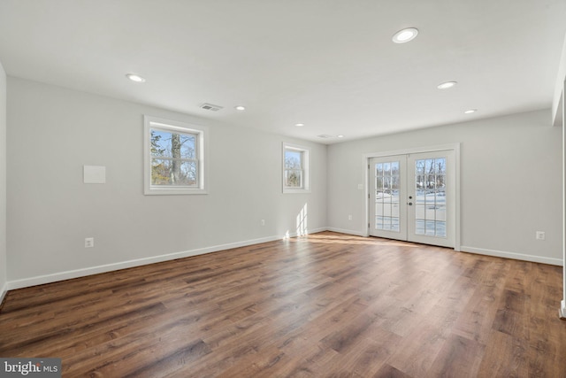 unfurnished room with french doors and dark wood-type flooring