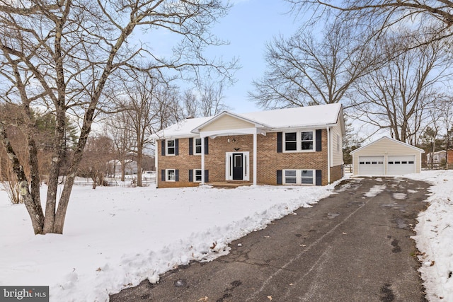 bi-level home with an outbuilding and a garage