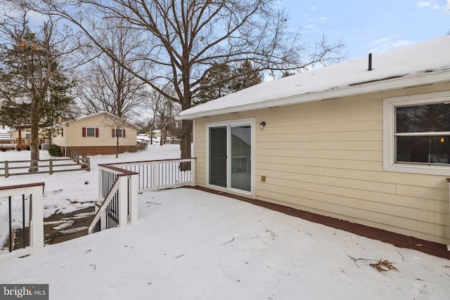 view of snow covered deck