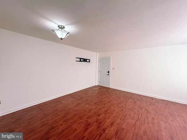 empty room with wood-type flooring