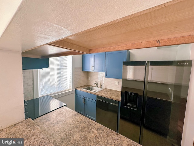 kitchen featuring stainless steel fridge, sink, blue cabinetry, tasteful backsplash, and black dishwasher