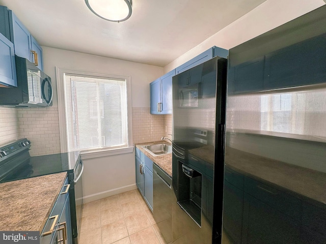 kitchen featuring black appliances, blue cabinetry, decorative backsplash, and sink