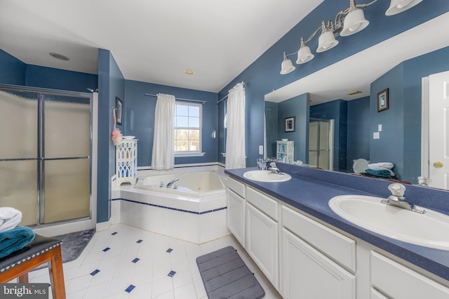 bathroom with tile patterned floors, vanity, and shower with separate bathtub