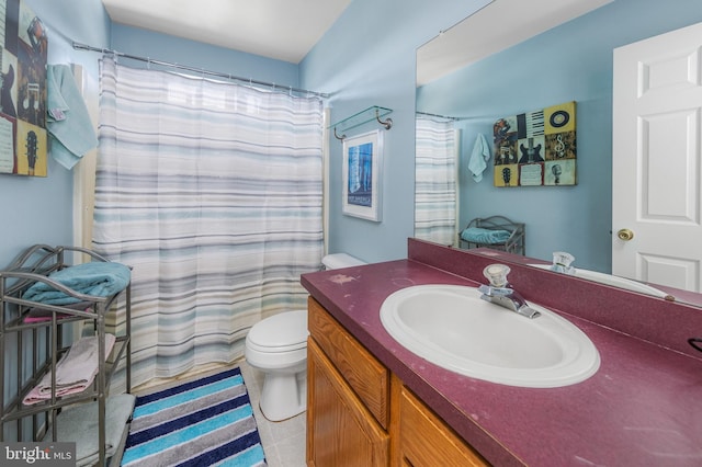 bathroom featuring vanity, a shower with shower curtain, and toilet