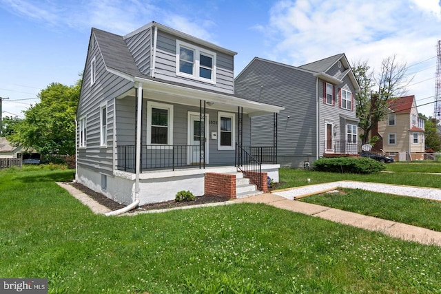 view of front facade featuring a porch and a front yard