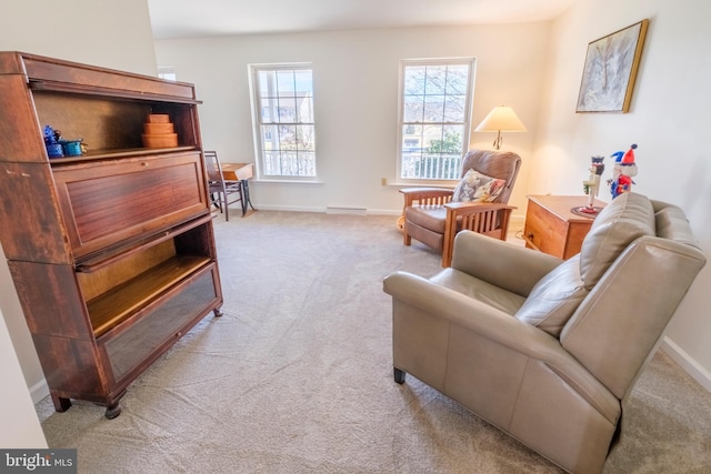 living area with light carpet