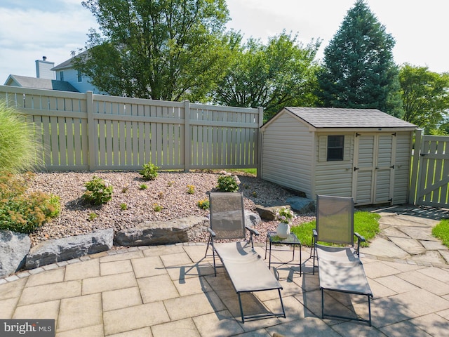 view of patio with a storage unit