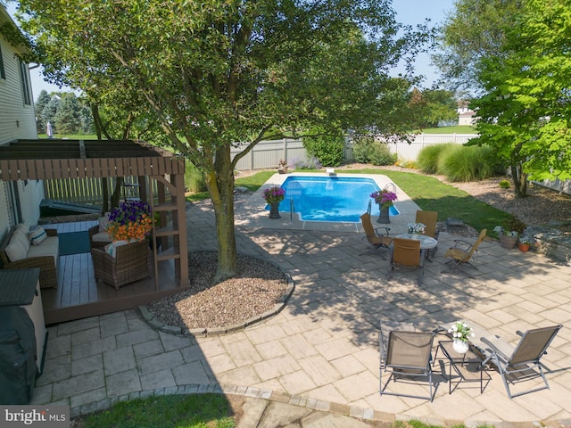 view of swimming pool with a patio and a pergola