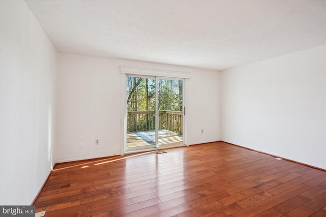 unfurnished room featuring wood-type flooring