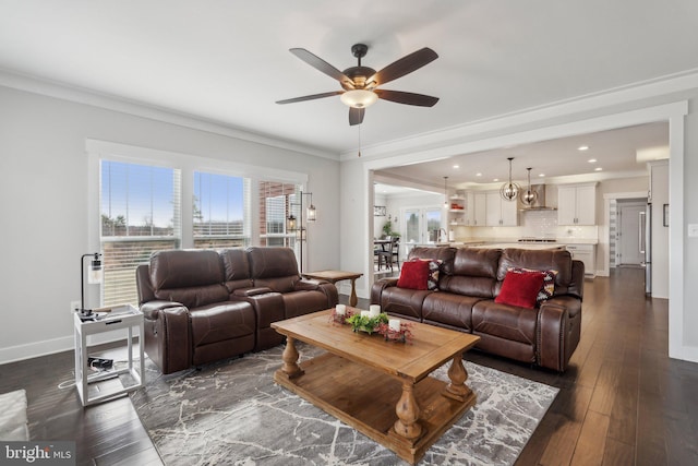 living room with crown molding, dark hardwood / wood-style floors, and ceiling fan