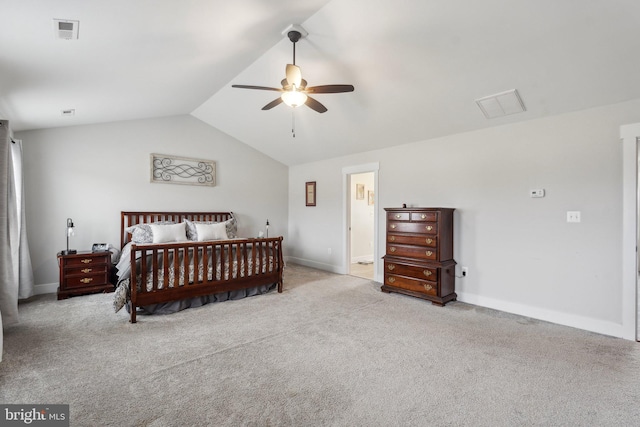 carpeted bedroom with ceiling fan and vaulted ceiling