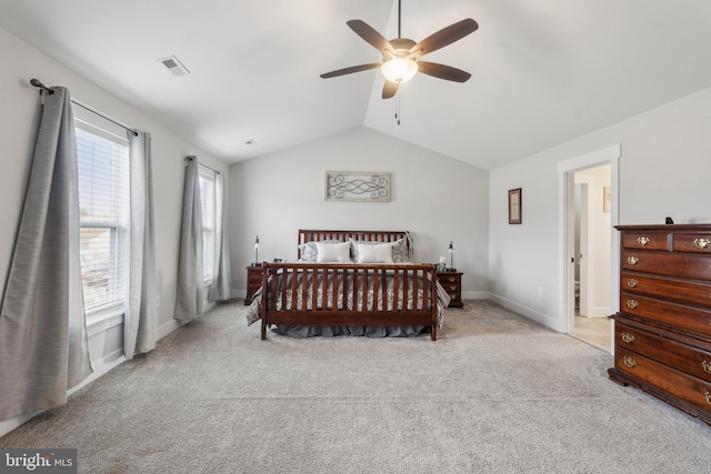 carpeted bedroom featuring vaulted ceiling and ceiling fan