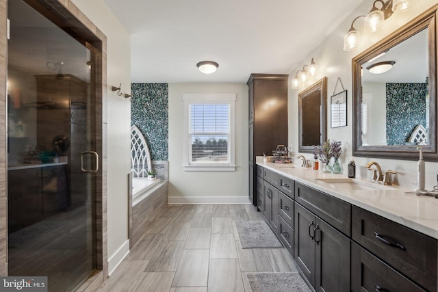 bathroom with vanity and independent shower and bath