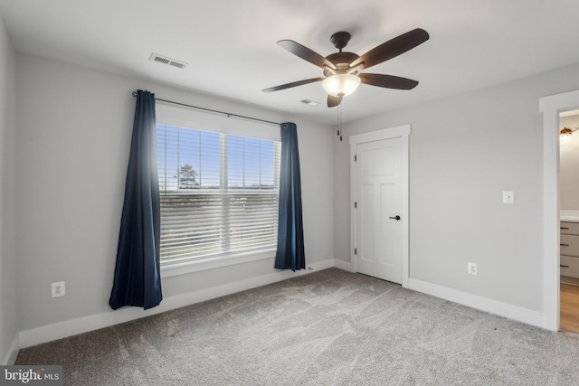 unfurnished room with light carpet and ceiling fan