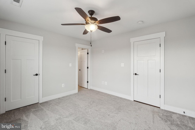 unfurnished bedroom with ceiling fan and light carpet