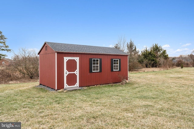 view of outdoor structure featuring a yard