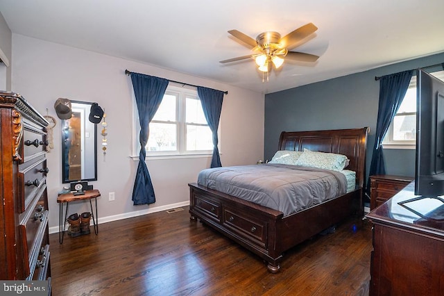 bedroom with ceiling fan and dark wood-type flooring