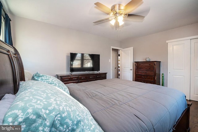 bedroom featuring ceiling fan and a closet