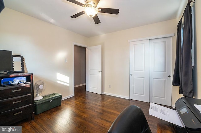 interior space with ceiling fan and dark hardwood / wood-style flooring