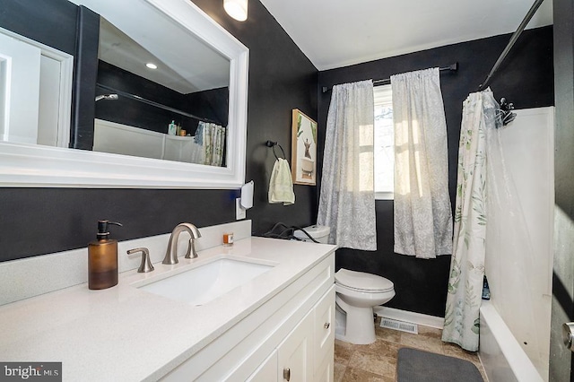 full bathroom with shower / tub combo, vanity, and toilet