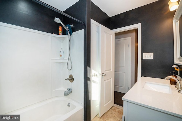 bathroom with vanity and washtub / shower combination