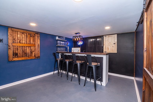 bar featuring decorative light fixtures