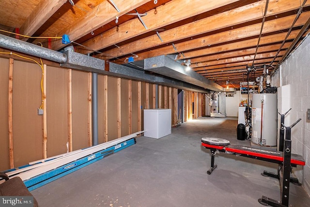 basement featuring heating unit and water heater