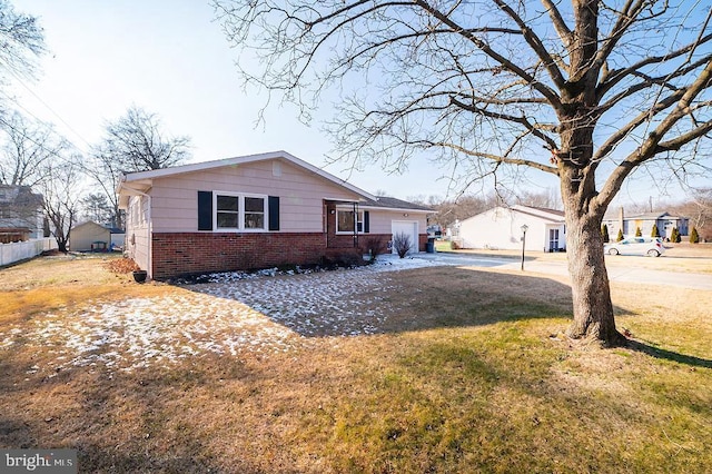 view of front facade with a front yard and a garage