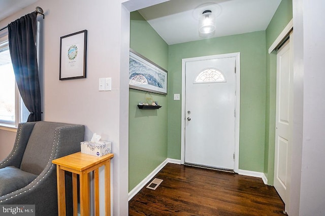 entrance foyer with dark hardwood / wood-style floors