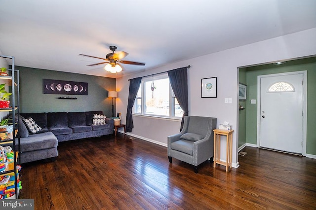 living room with ceiling fan and dark hardwood / wood-style floors