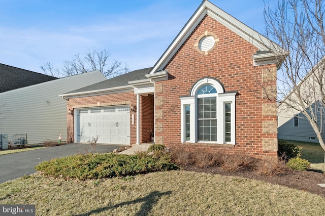 front of property featuring a garage and a front yard