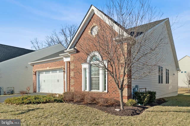 view of property exterior with a garage and a yard