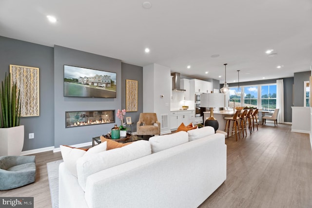 living room with light hardwood / wood-style floors