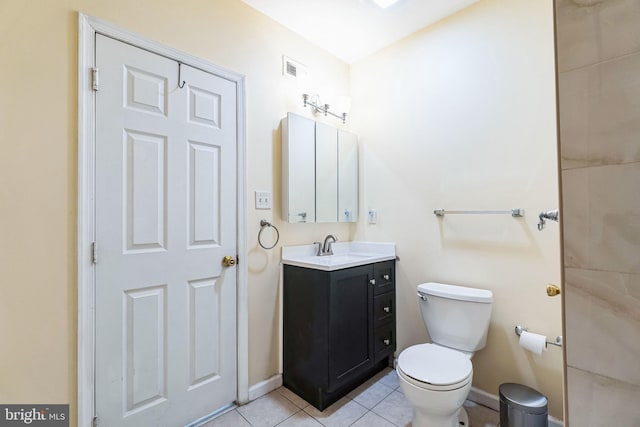 bathroom with tile patterned floors, vanity, and toilet