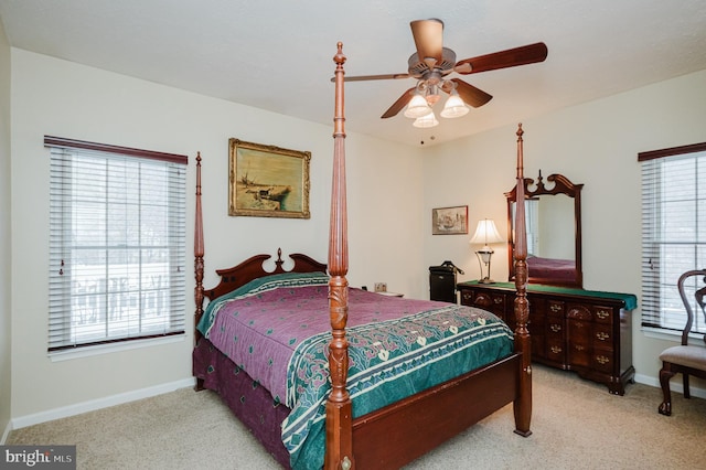 bedroom featuring light carpet and ceiling fan