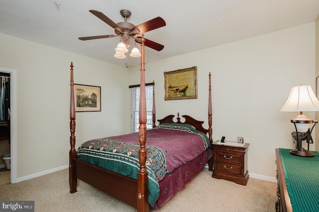 bedroom with light carpet and ceiling fan