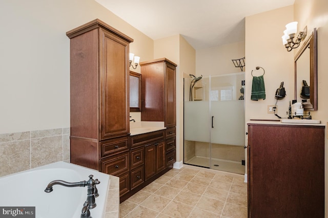 bathroom with vanity, tile patterned flooring, and independent shower and bath