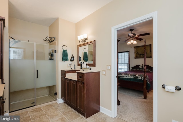 bathroom with an enclosed shower, ceiling fan, and vanity