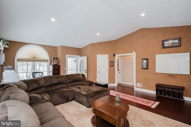 living room with lofted ceiling and dark hardwood / wood-style flooring