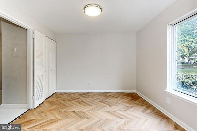 unfurnished bedroom featuring light parquet flooring