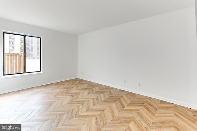 empty room with light parquet flooring