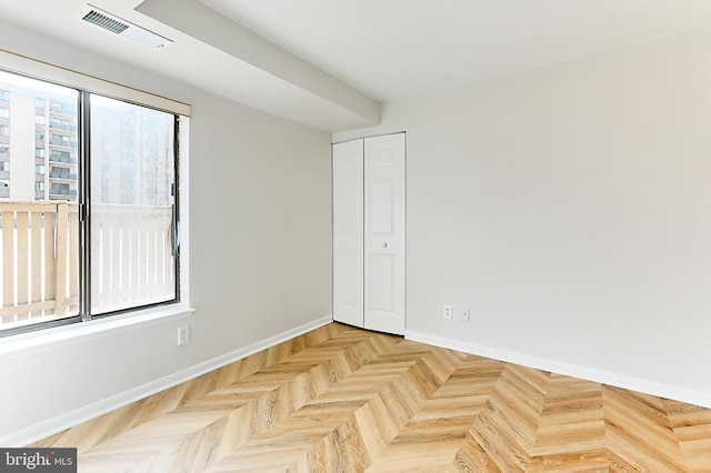 empty room featuring light parquet flooring