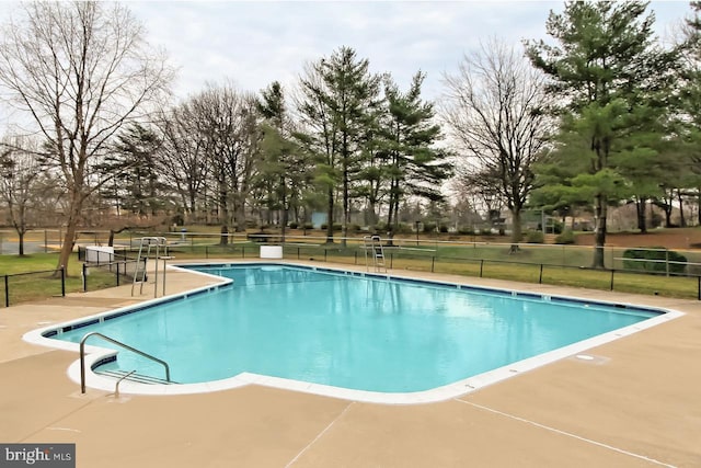 view of swimming pool featuring a patio area