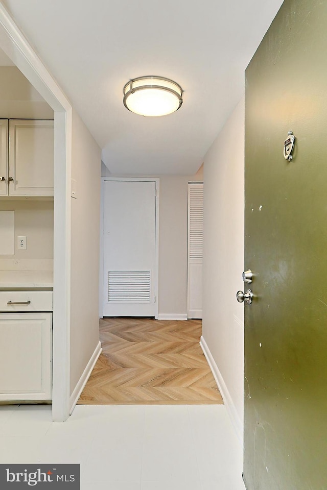 hallway featuring light parquet floors