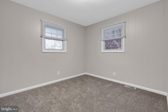 empty room with carpet flooring