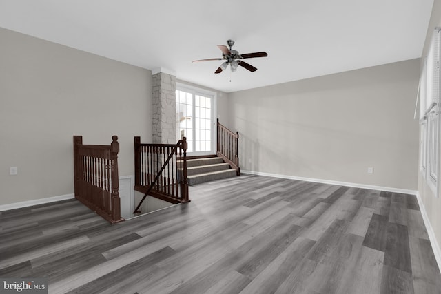 interior space with wood-type flooring and ceiling fan