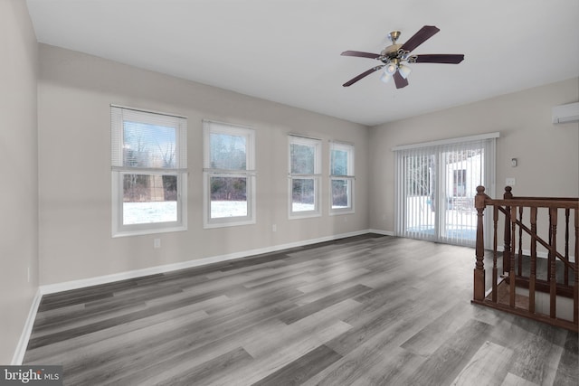 empty room with hardwood / wood-style flooring and ceiling fan