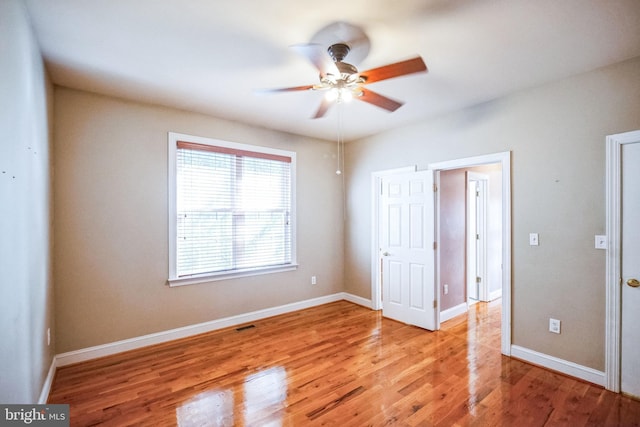 unfurnished bedroom with ceiling fan and light hardwood / wood-style floors