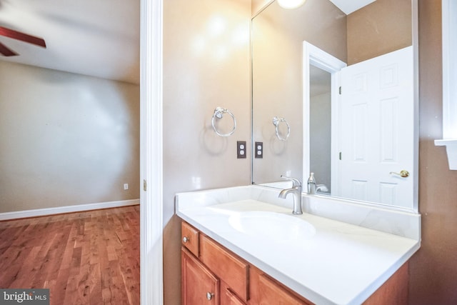 bathroom featuring vanity, hardwood / wood-style flooring, and ceiling fan